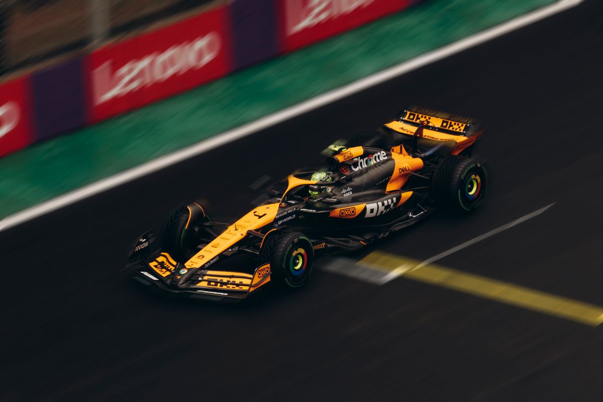 A Formula 1 car speeding down a race track during a race