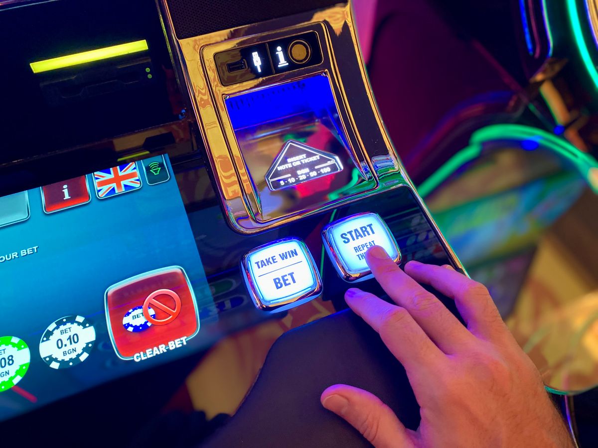 Slot machine reels spinning with bonus symbols in a casino