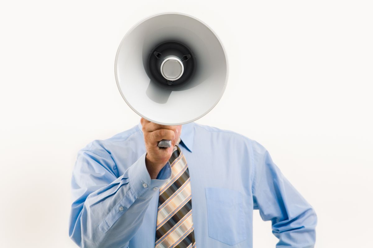 Person holding a megaphone announcing a promotion