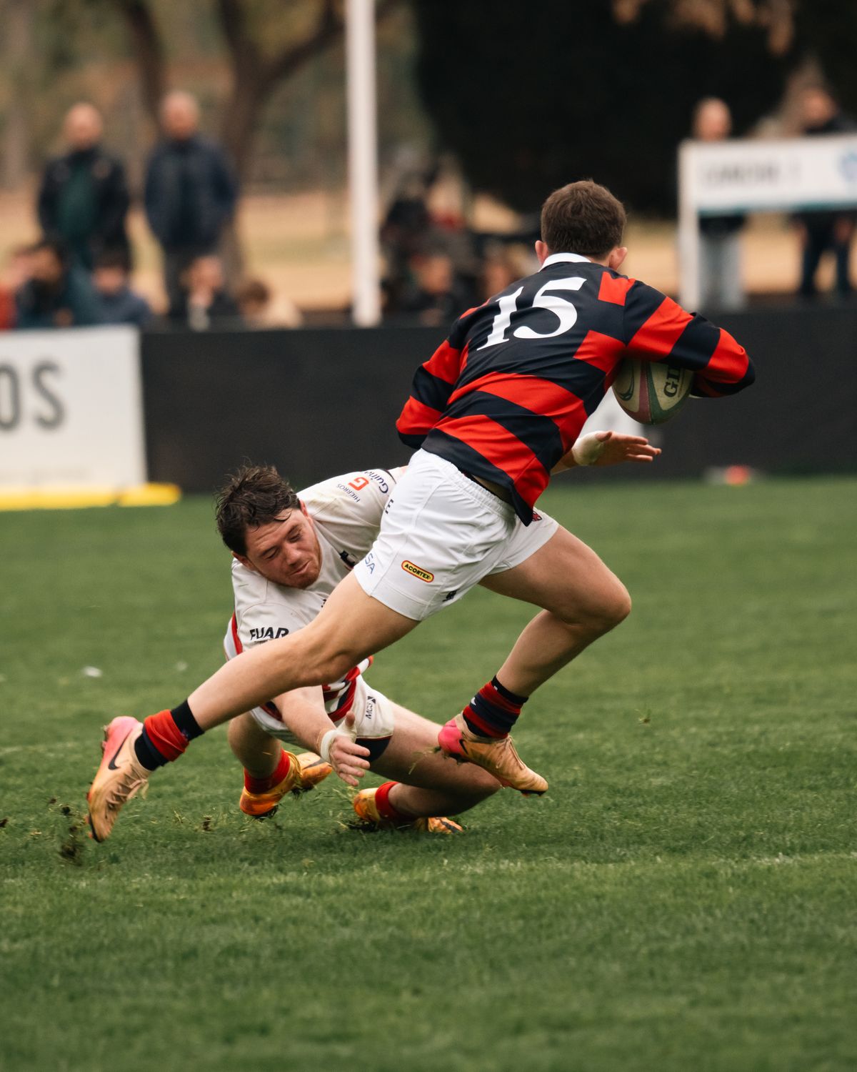 Rugby player tackling an opponent during a competitive match